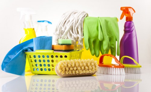 Move out cleaning in a kitchen area with surfaces being wiped